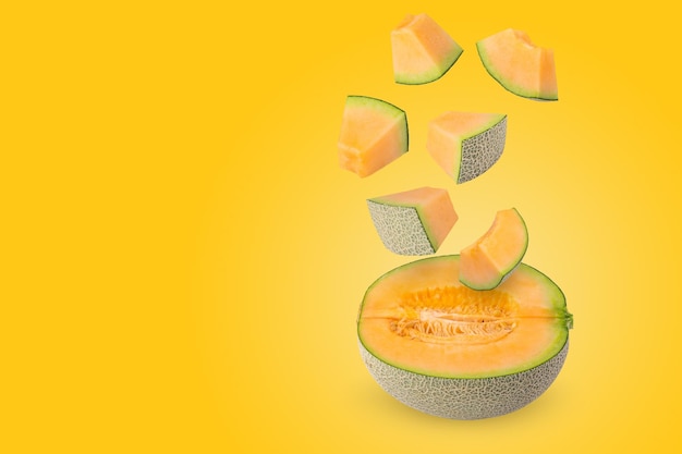 Creative layout made from melon on a pastel yellow background Fruit minimal concept and copy space