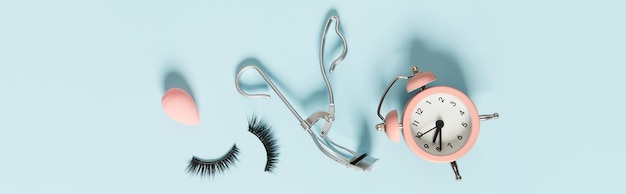 Creative layout with make up accessories on pastel blue background