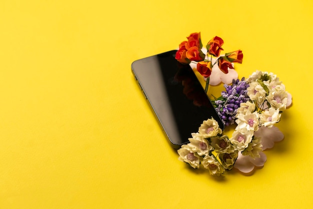 A creative layout with smartphone template mockup design and flowers around