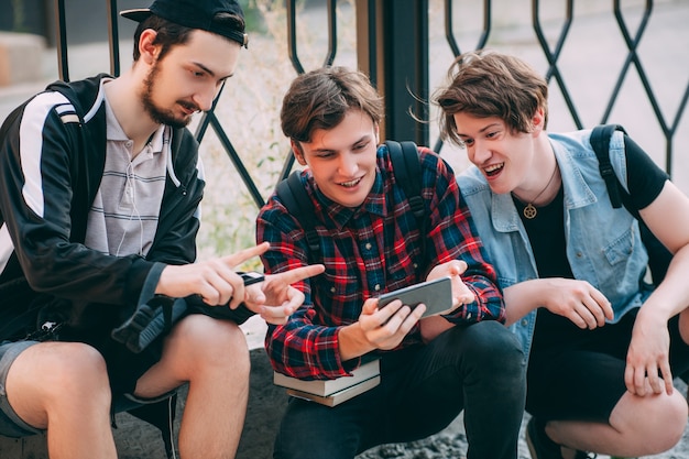 Creative mobile photo. modern technology. students hang out after classes. youth hipster lifestyle. bff friendship communication concept