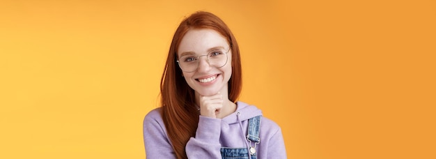 Creative outgoing young charismatic redhead female coworker discuss casual staff smiling laughing