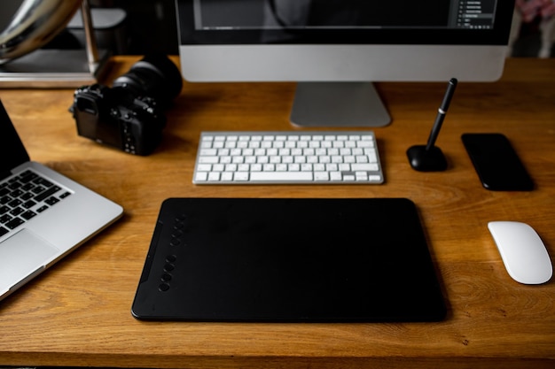 Creative professional designers desk from above designer workspace top view with essential elements ...