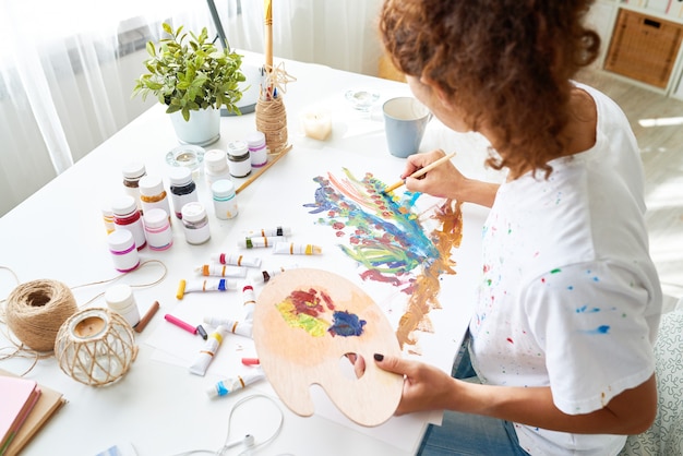 Creative Young Woman Painting Pictures