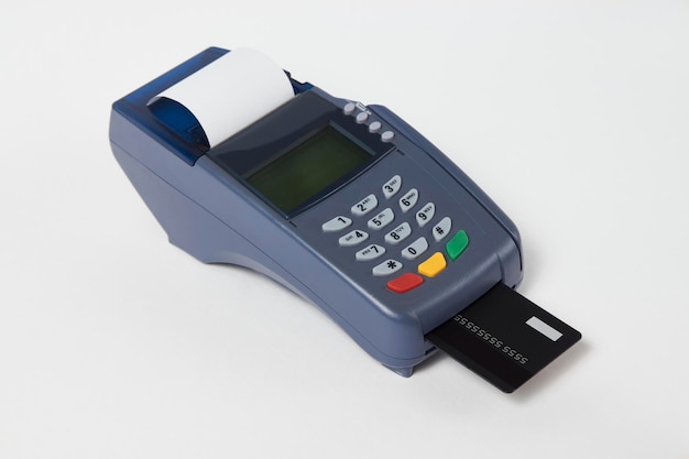 Credit card payment, buy and sell service. Payment terminal and credit card on white background