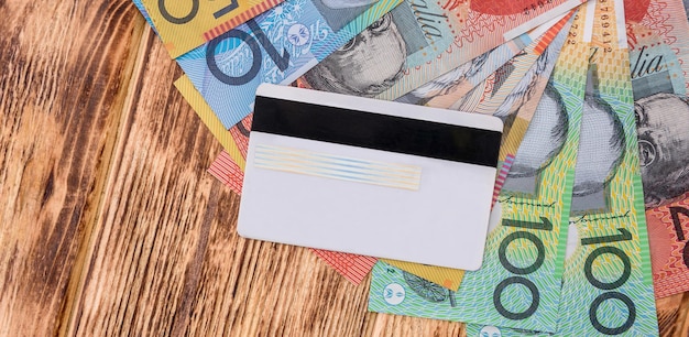 credit card with Australian dollars on the table