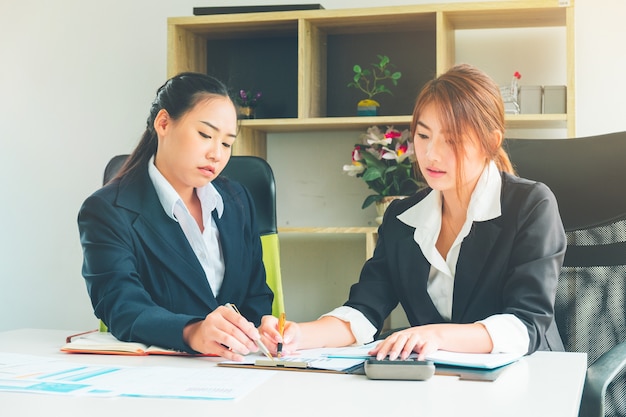 Credit Officer team working and analysis loan data chart in office