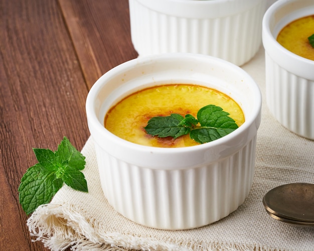 Crema catalana, Spanish dessert on brown wooden table