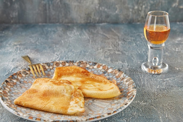 Crepe Suzette pancakes with cognac and citrus sauce