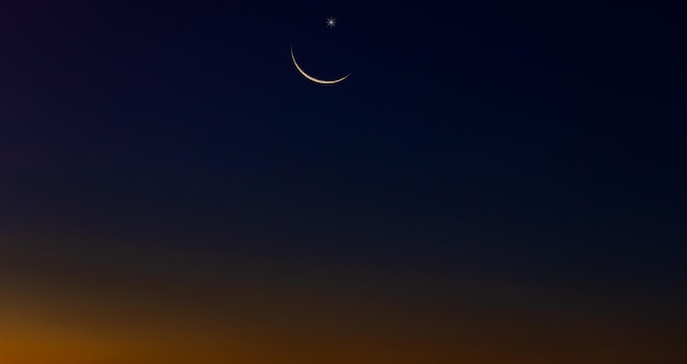 Crescent moon on dusk sky twilight and free space for text religion of islamic