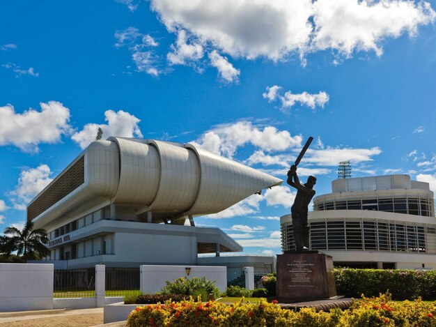 Cricket Statue and Modern Stadium Architecture