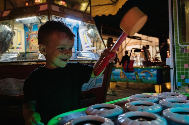 CRIMEA GURZUF SEPTEMBER 022021 A boy plays slot machines in the amusement park