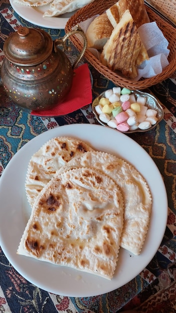 Crimean national pie, traditional bakery from Crimea, chef filling dough in home with meat and vegetables, homemade.