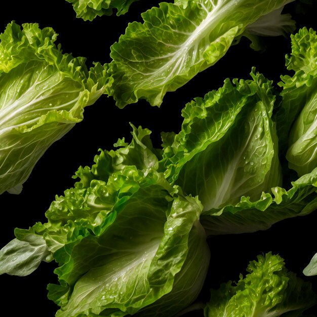 Photo crisp lettuce leaves caught midsplash glistening against a stark black background