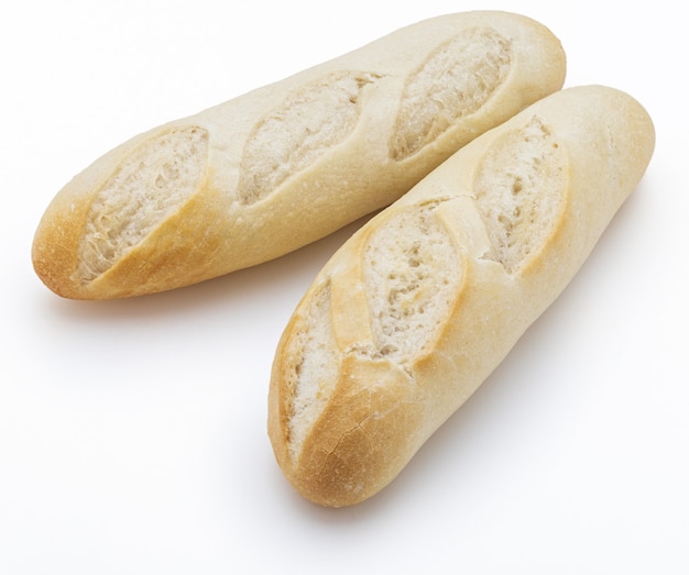 Crisp loaves of freshly made white bread. Isolated.