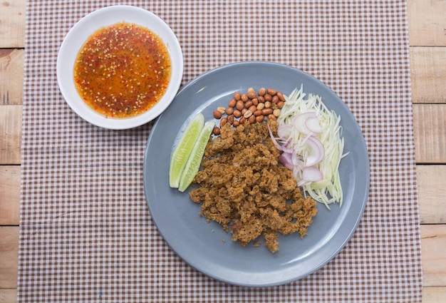 Crispy catfish salad with green mango in thailand