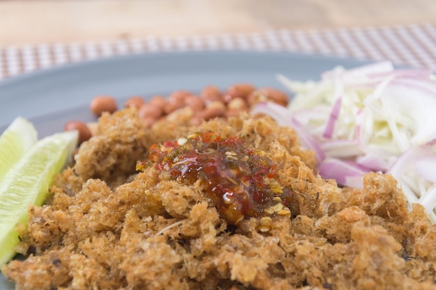 Crispy catfish salad with green mango in thailand