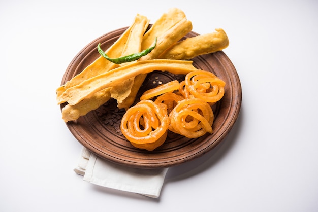 Crispy Fafda with sweet jalebi is an Indian snack most popular in Gujarat, selective focus