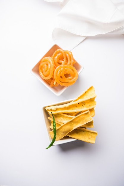 Crispy Fafda with sweet jalebi is an Indian snack most popular in Gujarat, selective focus