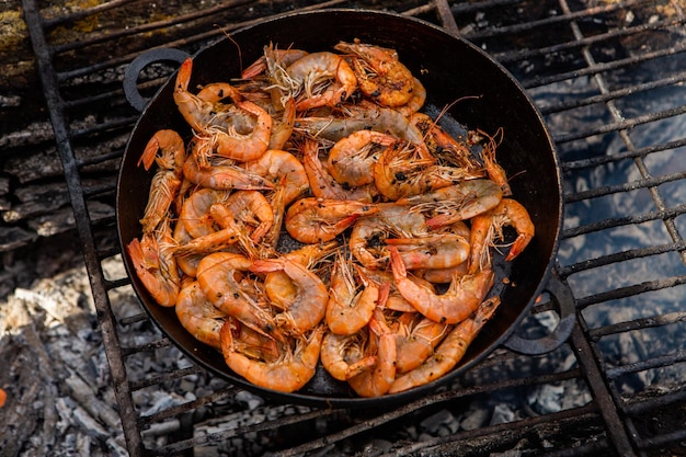 crispy fresh shrimp cooked on a frying pan in the wild