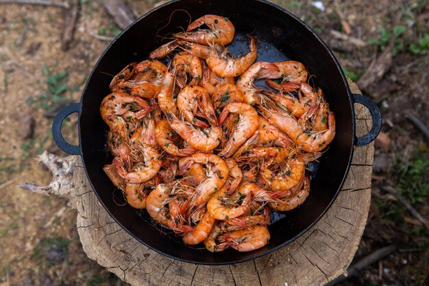 crispy fresh shrimp cooked on a frying pan in the wild