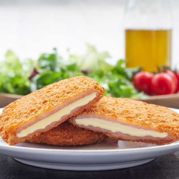 Crispy fried food with chicken cheese and ham San Jacobo Salad to accompany