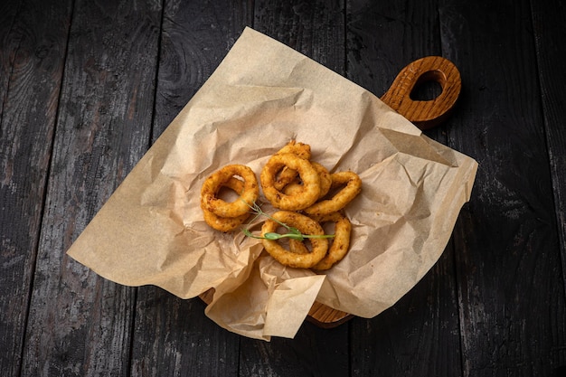 Crispy Fried Squid Rings. On a dark background