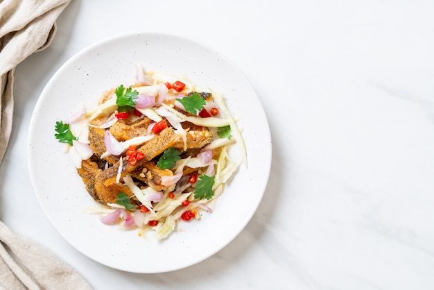 crispy gourami fish with spicy salad