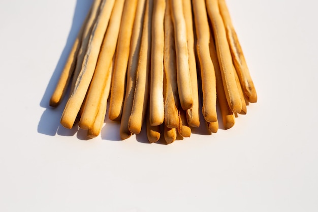 Crispy italian bread sticks on white