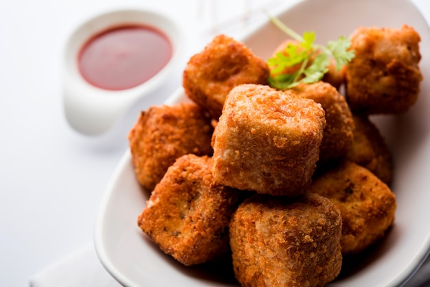 Crispy Paneer popcorn is a popular party snack and an appetiser. selective focus