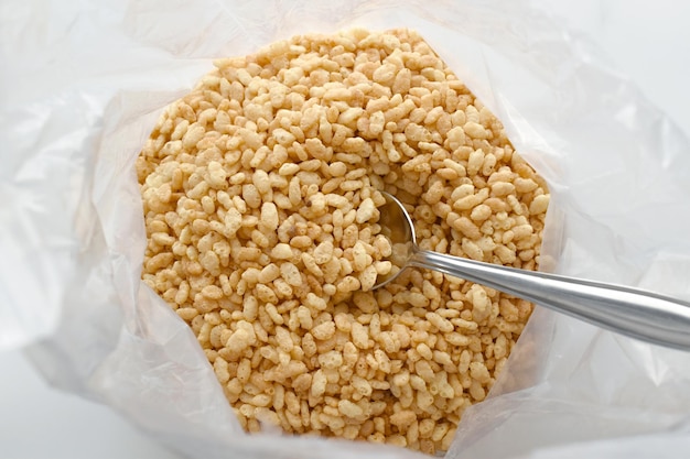 Crispy rice cereal with a spoon in a plastic bag