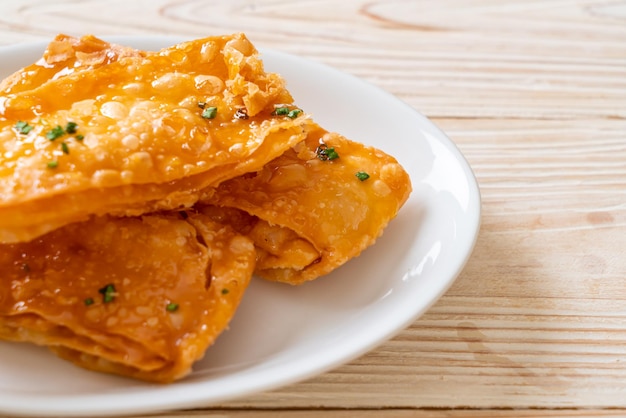 crispy roti with sugar on plate