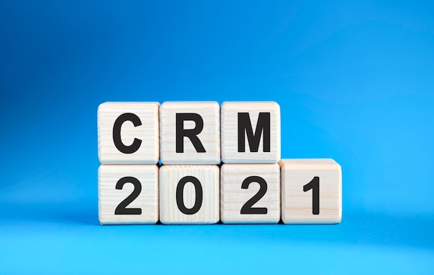 CRM 2021 years on wooden cubes on a blue background