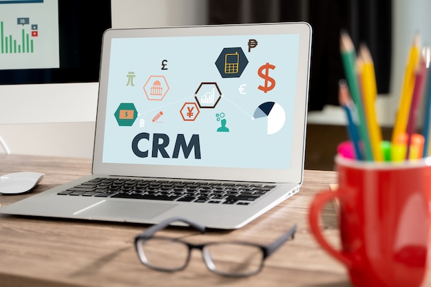 Photo crm business customer crm management analysis service concept business team hands at work with financial reports and a laptop