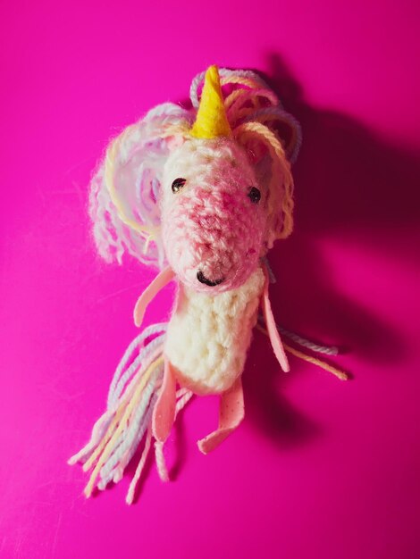 A crocheted toy of the cute unicorn