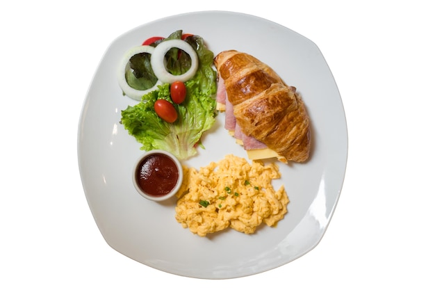 Croffle is a combination of croissant and waffle. This croffle served on a white plate