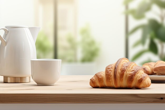 A croissant and coffee are placed on a kitchen countertop with a blurred minimalist interior and mod