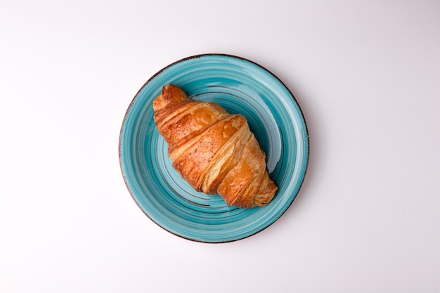 Croissant croissant with filling food on a white background isolated