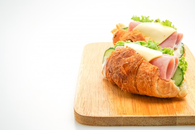 Croissant filled with ham and cheese with 
mayonnaise