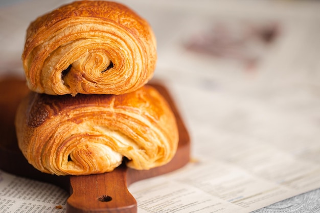 Croissant macro. French croissant with waves. Air baking. Croissant for puff pastry advertising.