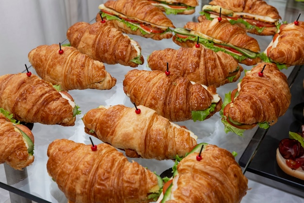 Croissant sandwich on the buffet table. Catering for business meetings, events and celebrations.