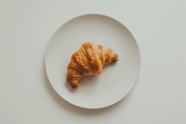 Croissant on white plate