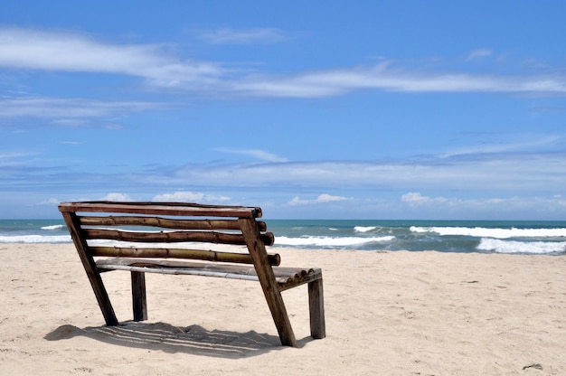 Crooked bench on the beach