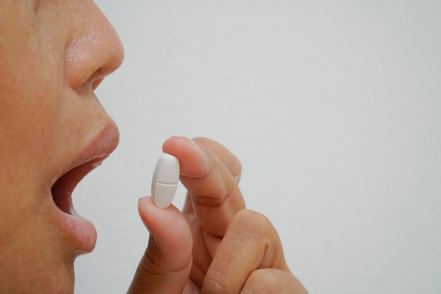 Crop close up of woman have medications for illness or virus prevention