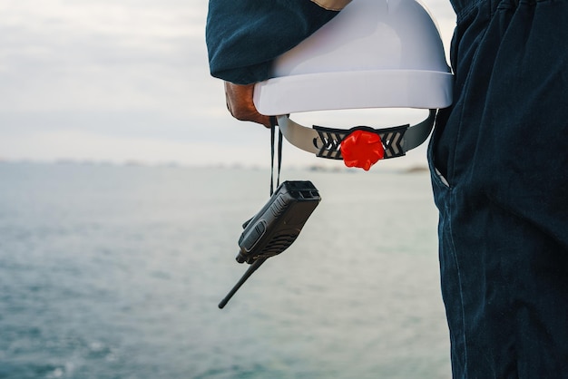 Crop maritime worker admiring sea