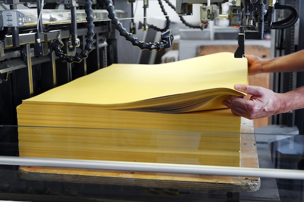 Crop worker loading paper into printer