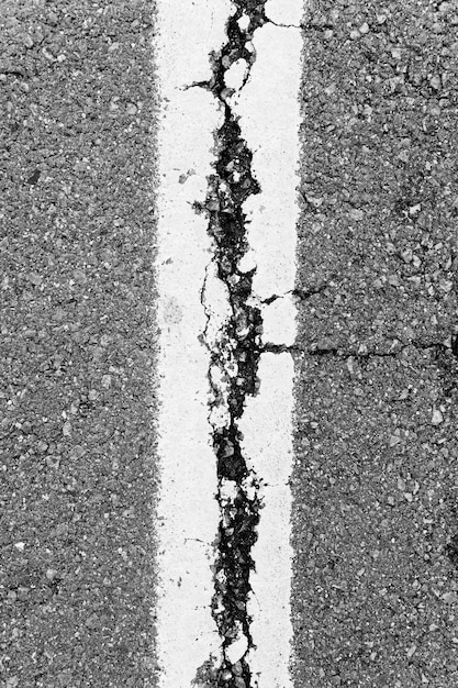 Cropped background texture of rough Cracked asphalt