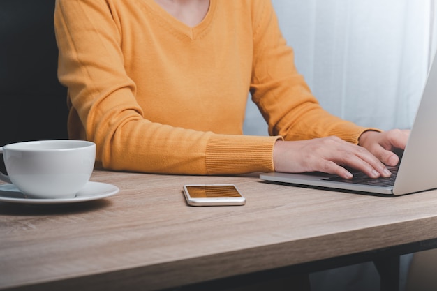 Cropped image of business woman working on computer in the office