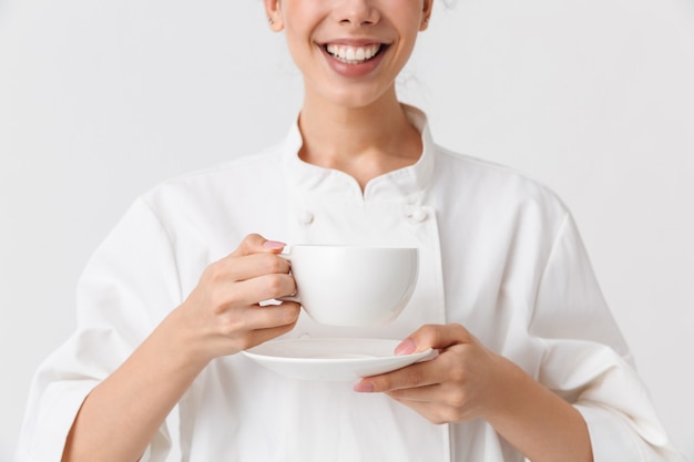 Cropped image of a cheerful young woman cooking