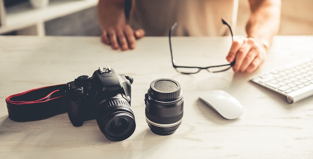 Cropped image of handsome young photographer.