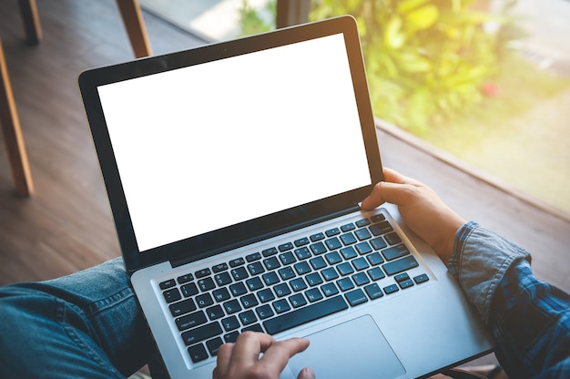 Cropped image of a man working on his laptop